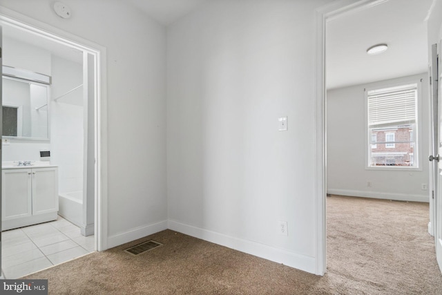 1816 Chilton St, Baltimore, MD 21218 - spare room with light carpet and a smoke detector