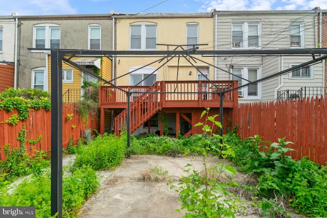 1816 Chilton St, Baltimore, MD 21218 - back of property with stairway, a deck, and stucco siding