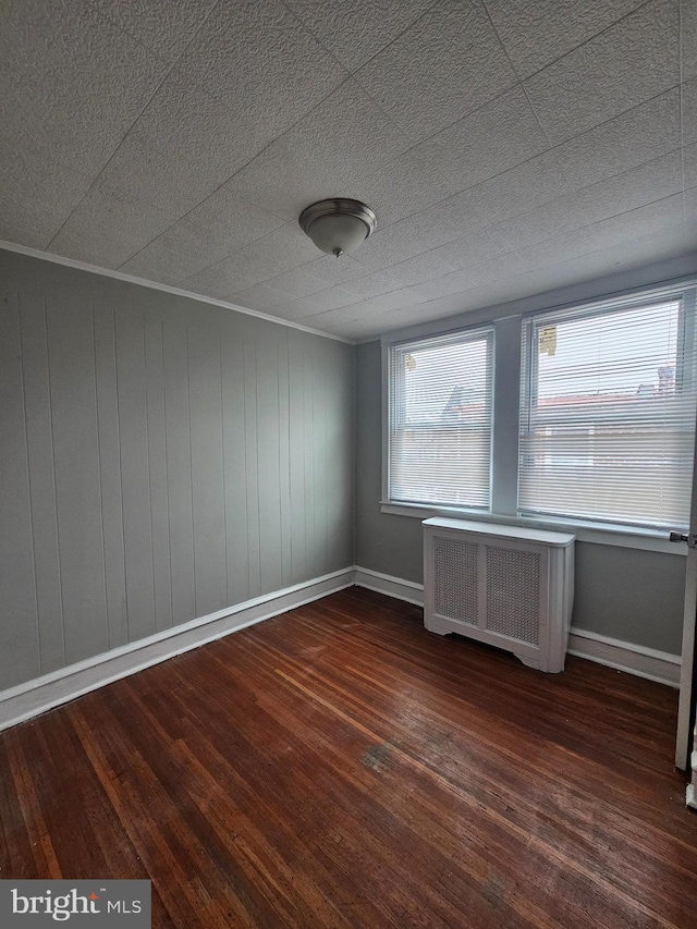 3902 Howland St, Philadelphia, PA 19124 - spare room with radiator and wood finished floors