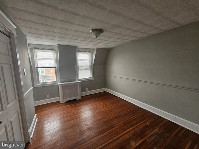 3902 Howland St, Philadelphia, PA 19124 - spare room with radiator and dark wood finished floors