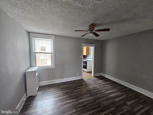 3902 Howland St, Philadelphia, PA 19124 - unfurnished room with dark wood finished floors, a ceiling fan, and a textured ceiling