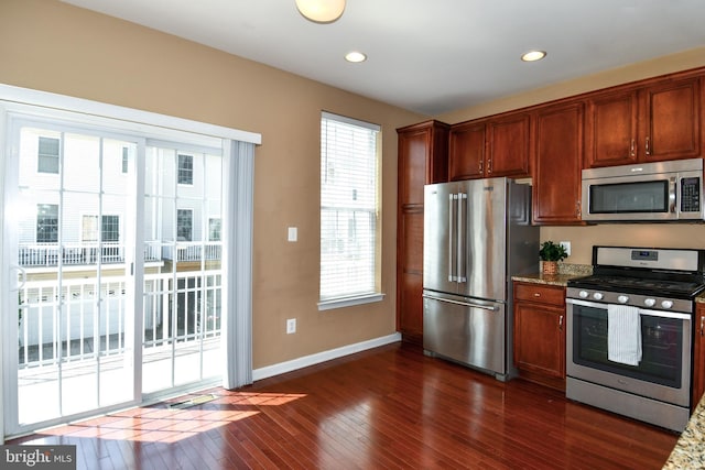 42825 Pamplin Ter, Chantilly, VA 20152 - kitchen featuring appliances with stainless steel finishes, dark wood-type flooring, stone counters, and recessed lighting