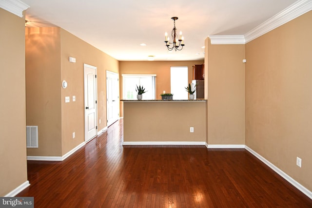 42825 Pamplin Ter, Chantilly, VA 20152 - kitchen featuring a chandelier, freestanding refrigerator, dark wood-type flooring, crown molding, and hanging light fixtures