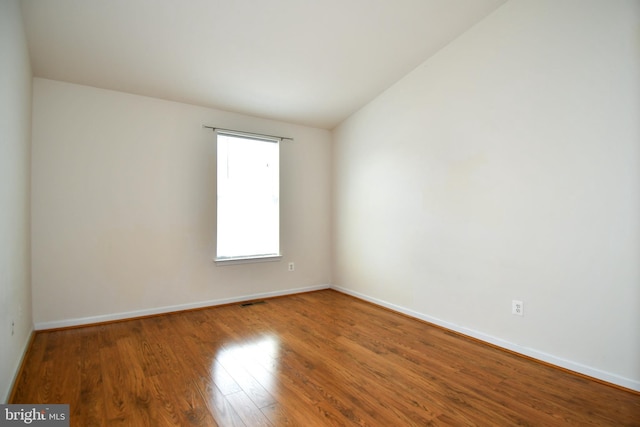 42825 Pamplin Ter, Chantilly, VA 20152 - empty room featuring wood finished floors and vaulted ceiling
