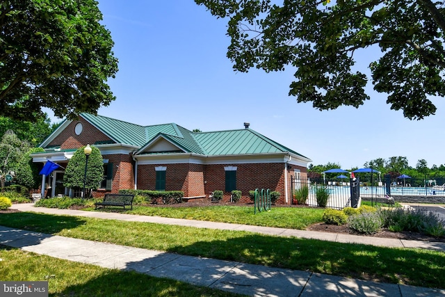 42825 Pamplin Ter, Chantilly, VA 20152 - view of front facade with brick siding and a standing seam roof
