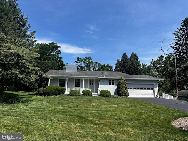 102 Old Ford Dr, Camp Hill, PA 17011 - ranch-style home featuring covered porch, asphalt driveway, an attached garage, a chimney, and a front yard