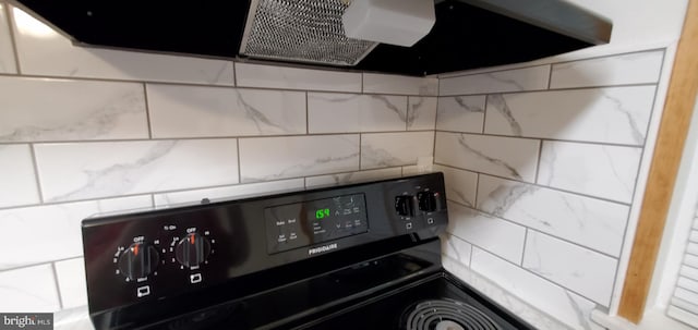 53 Snow Bird Trl, Fairfield, PA 17320 - kitchen view of black range with electric stovetop, extractor fan, and decorative backsplash