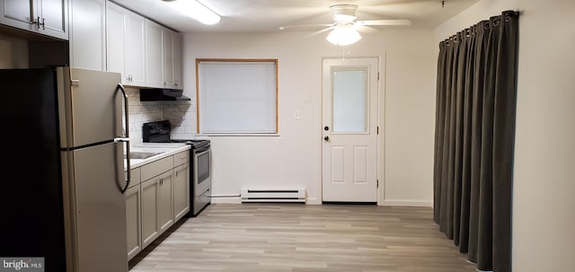 53 Snow Bird Trl, Fairfield, PA 17320 - kitchen featuring stainless steel appliances, a baseboard heating unit, backsplash, light wood finished floors, and extractor fan