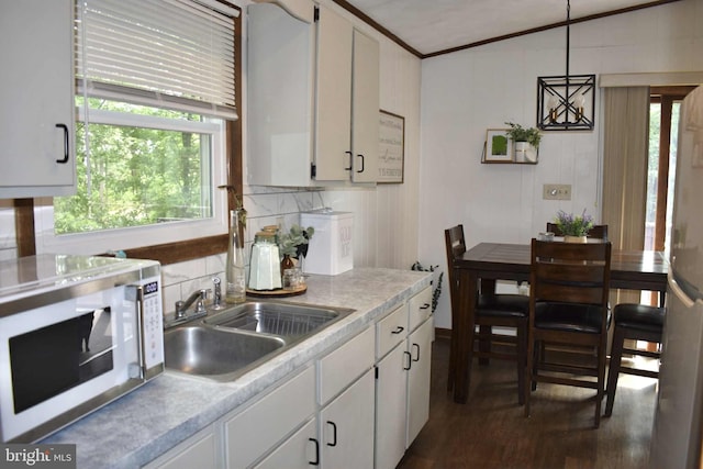 53 Snow Bird Trl, Fairfield, PA 17320 - kitchen with white microwave, dark wood-style flooring, white cabinets, light countertops, and crown molding