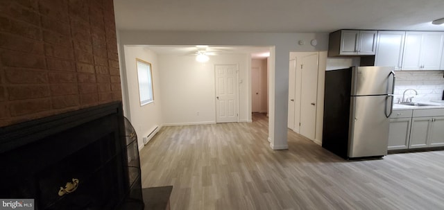 53 Snow Bird Trl, Fairfield, PA 17320 - kitchen featuring freestanding refrigerator, a ceiling fan, light wood-style floors, and a baseboard heating unit