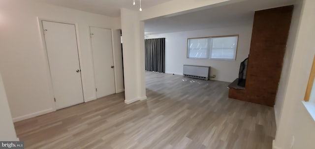 53 Snow Bird Trl, Fairfield, PA 17320 - unfurnished living room with radiator and light wood-style flooring