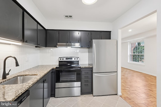 4000 Gypsy Ln Unit 529, Philadelphia, PA 19129 - kitchen with stainless steel appliances, under cabinet range hood, light stone countertops, backsplash, and recessed lighting