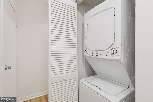 4000 Gypsy Ln Unit 529, Philadelphia, PA 19129 - laundry room featuring stacked washer / dryer and wood finished floors