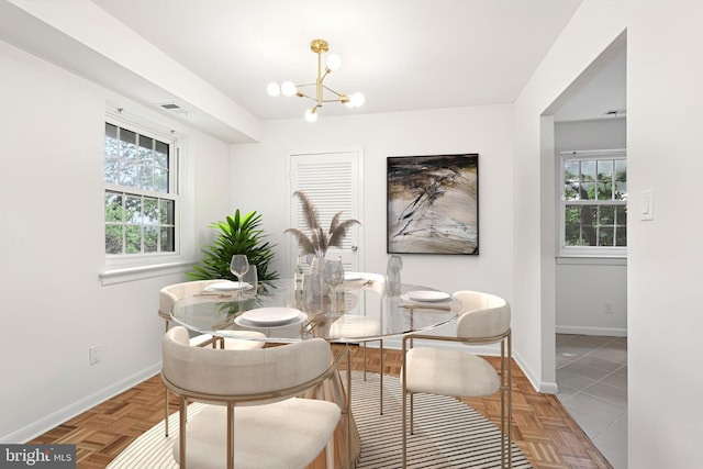 4000 Gypsy Ln Unit 529, Philadelphia, PA 19129 - dining space featuring a chandelier and plenty of natural light