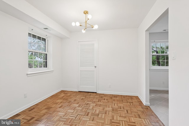 4000 Gypsy Ln Unit 529, Philadelphia, PA 19129 - unfurnished room featuring a chandelier and baseboards