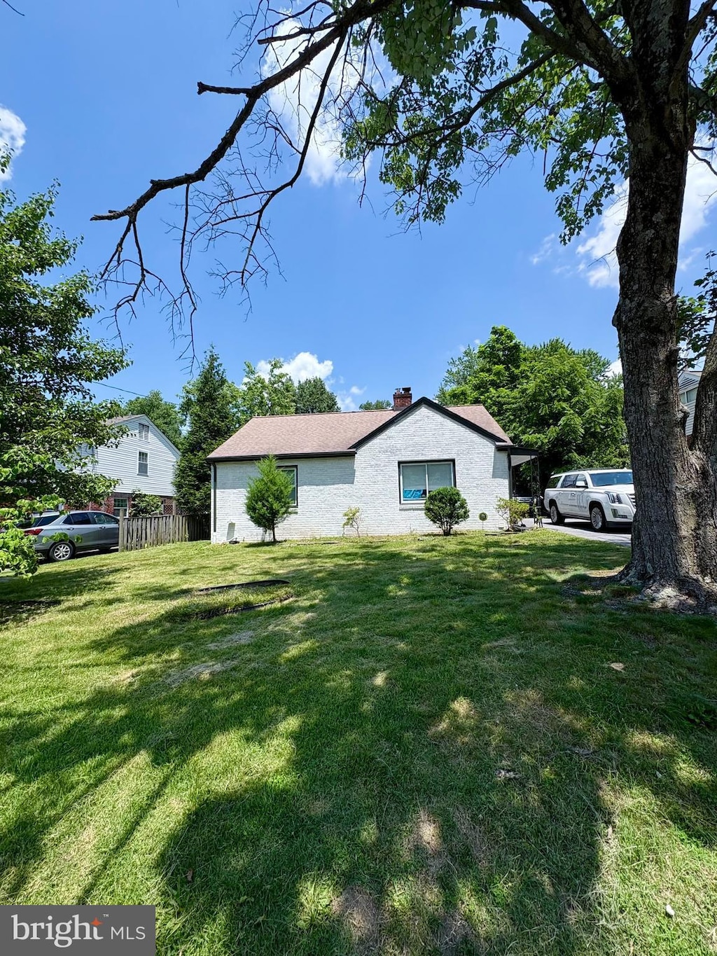 2609 Fenimore Rd, Silver Spring, MD 20902 - view of side of home featuring a chimney