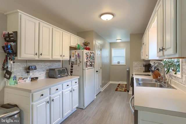 112 Lynmar Ave, Palmyra, PA 17078 - kitchen featuring white appliances, decorative backsplash, white cabinetry, and light wood-style flooring