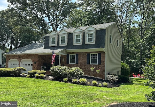 504 Green Forest Dr, Severna Park, MD 21146 - view of front of home with a gambrel roof, an attached garage, a front yard, and brick siding