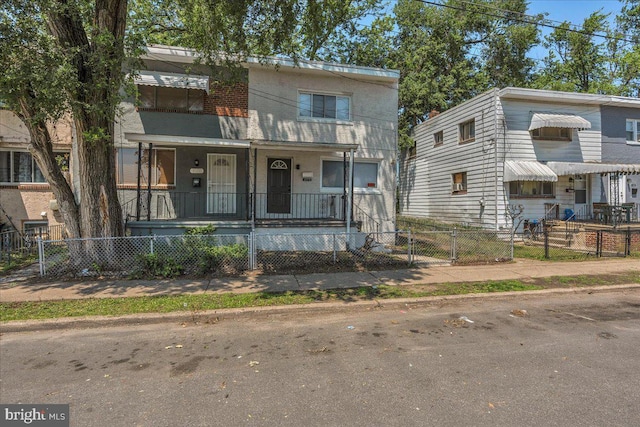 1579 S 8th St, Camden, NJ 08104 - view of property featuring covered porch, a gate, and a fenced front yard