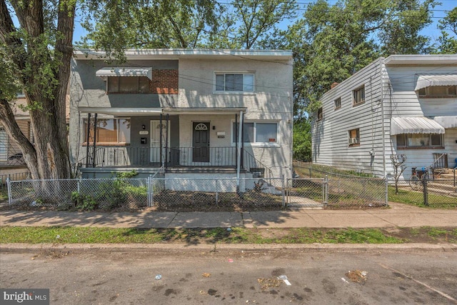 1579 S 8th St, Camden, NJ 08104 - view of front of home featuring a porch, a gate, and a fenced front yard