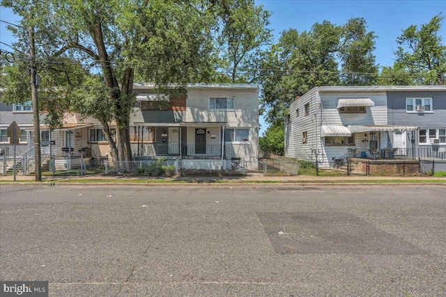 1579 S 8th St, Camden, NJ 08104 - townhome / multi-family property with a fenced front yard and a porch