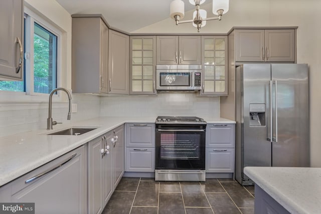 5606 Eastbourne Dr, Springfield, VA 22151 - kitchen with appliances with stainless steel finishes, gray cabinetry, tasteful backsplash, light countertops, and lofted ceiling