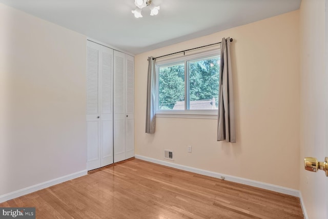 5606 Eastbourne Dr, Springfield, VA 22151 - unfurnished bedroom with light wood-style floors and a closet