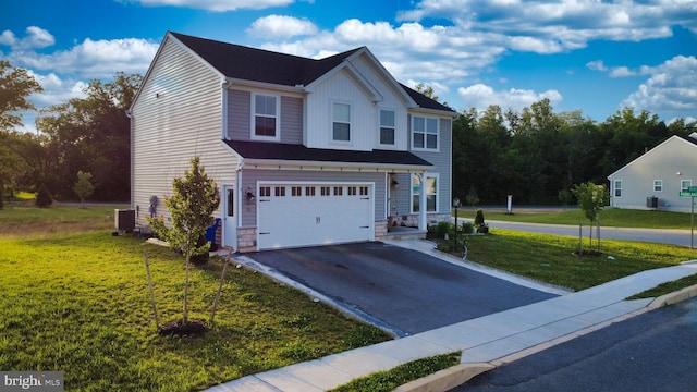 15 Long Bend Dr, Carlisle, PA 17015 - view of front of property with driveway, a garage, a front lawn, stone siding, and board and batten siding
