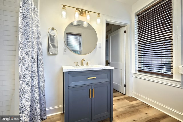 137 S E St, Spring Grove, PA 17362 - bathroom featuring wood finished floors, vanity, and a shower with shower curtain