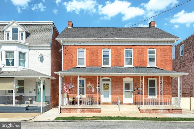 137 S E St, Spring Grove, PA 17362 - townhome / multi-family property featuring a porch, a chimney, and brick siding