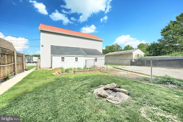 137 S E St, Spring Grove, PA 17362 - rear view of house with a metal roof, a garden, and a gate