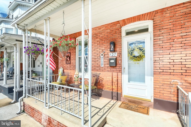 137 S E St, Spring Grove, PA 17362 - property entrance featuring brick siding and a porch