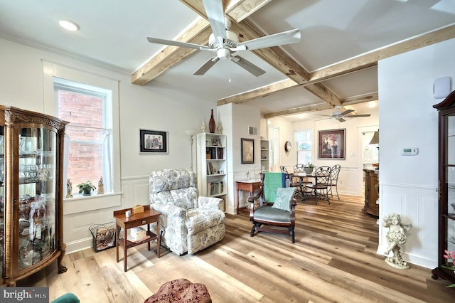 137 S E St, Spring Grove, PA 17362 - sitting room featuring a ceiling fan, beam ceiling, wood finished floors, a decorative wall, and a wainscoted wall