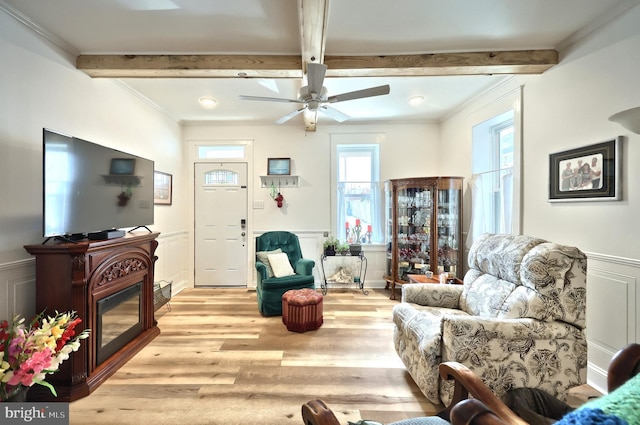 137 S E St, Spring Grove, PA 17362 - living room featuring a decorative wall, beamed ceiling, crown molding, light wood-type flooring, and a ceiling fan