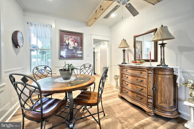 137 S E St, Spring Grove, PA 17362 - dining space with a decorative wall, a ceiling fan, beamed ceiling, light wood-style floors, and wainscoting