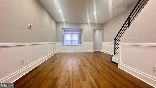 5841 Cedarhurst St, Philadelphia, PA 19143 - unfurnished living room with wood finished floors, wainscoting, stairs, and recessed lighting