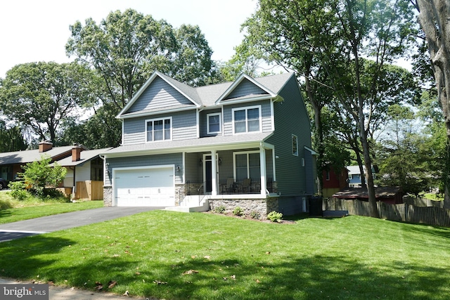 207 Beverley Ave, Edgewater, MD 21037 - craftsman-style house featuring asphalt driveway, a garage, stone siding, and a porch