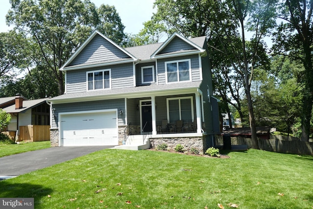 207 Beverley Ave, Edgewater, MD 21037 - craftsman-style home with a garage, driveway, covered porch, and stone siding