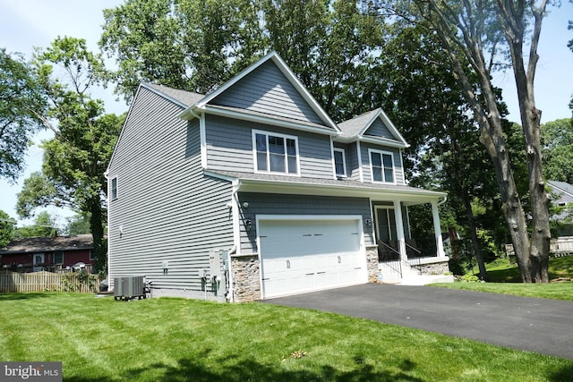 207 Beverley Ave, Edgewater, MD 21037 - craftsman-style home with an attached garage, asphalt driveway, and stone siding
