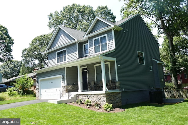 207 Beverley Ave, Edgewater, MD 21037 - craftsman-style home with a porch, a front lawn, an attached garage, and asphalt driveway