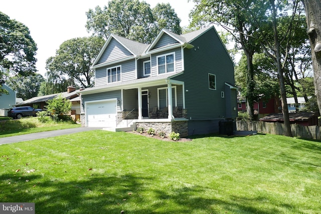 207 Beverley Ave, Edgewater, MD 21037 - craftsman inspired home featuring a porch, driveway, stone siding, and an attached garage