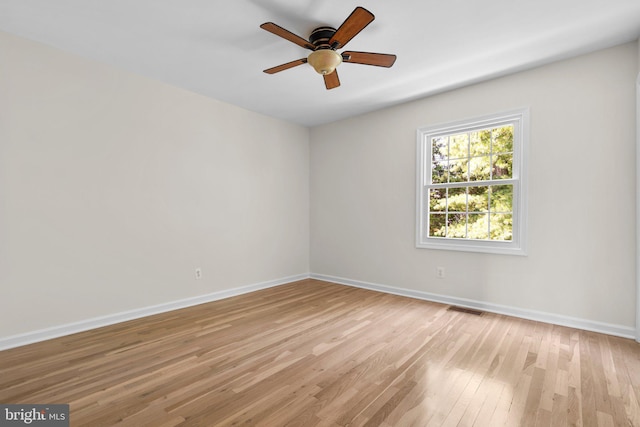 8384 Forrester Blvd, Springfield, VA 22152 - empty room with light wood-style floors and ceiling fan