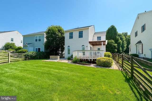 5 Mccarty Ct, Sterling, VA 20165 - rear view of property with a fenced backyard and a wooden deck