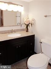 23311 Sugar Maple Ct Unit 1, California, MD 20619 - bathroom featuring vanity and toilet
