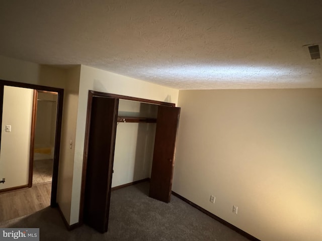 23311 Sugar Maple Ct Unit 1, California, MD 20619 - unfurnished bedroom featuring a closet, a textured ceiling, and carpet floors