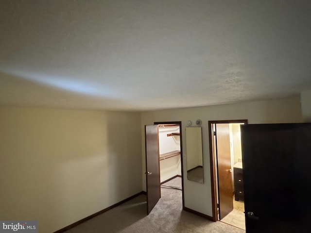 23311 Sugar Maple Ct Unit 1, California, MD 20619 - unfurnished bedroom with baseboards and light colored carpet