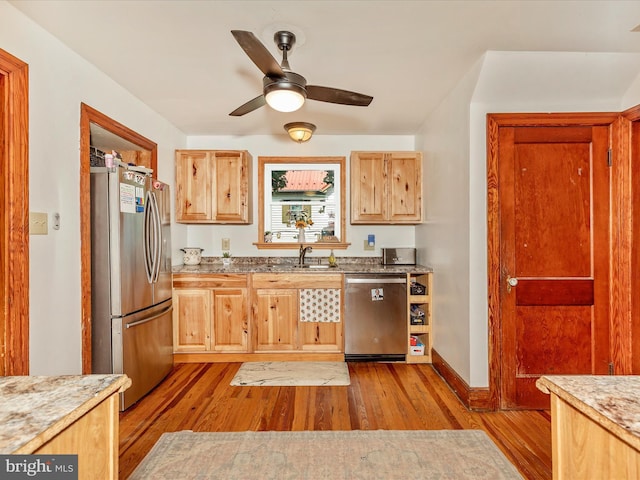 21127 Twin Springs Dr, Smithsburg, MD 21783 - kitchen with stainless steel appliances, wood finished floors, a ceiling fan, light brown cabinetry, and light stone countertops