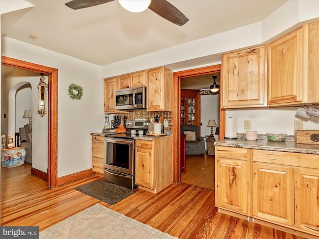 21127 Twin Springs Dr, Smithsburg, MD 21783 - kitchen with appliances with stainless steel finishes, light wood-type flooring, and decorative backsplash