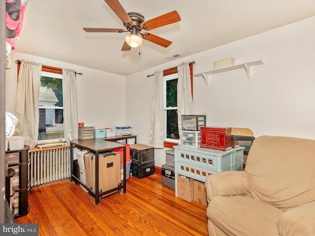 21127 Twin Springs Dr, Smithsburg, MD 21783 - home office with radiator heating unit, wood finished floors, and ceiling fan