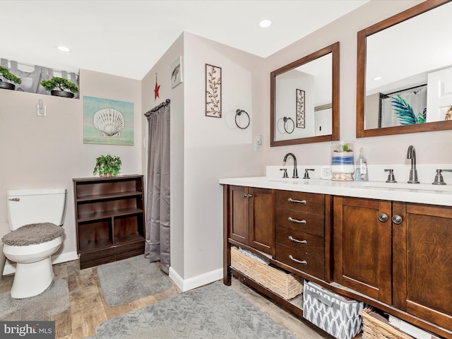 21127 Twin Springs Dr, Smithsburg, MD 21783 - full bathroom with double vanity, wood finished floors, and recessed lighting